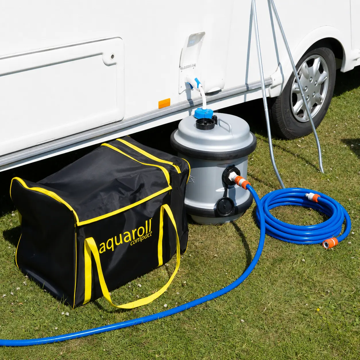 UK touring caravan connected to mains water on a serviced pitch
