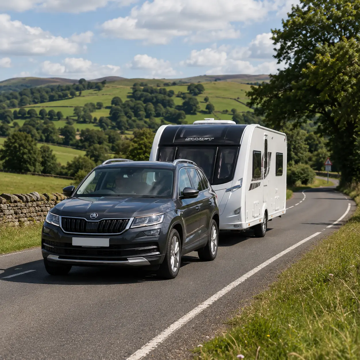 Uk tow car towing a caravan safely on a British road