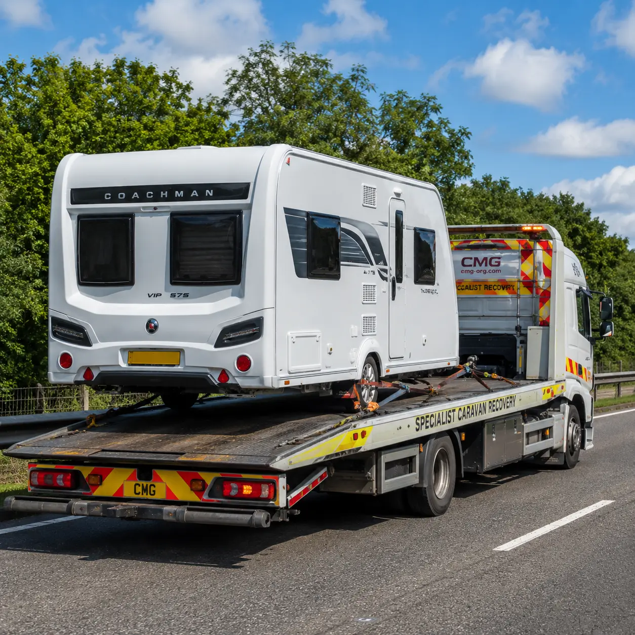 Specialist vehicle recovering a caravan