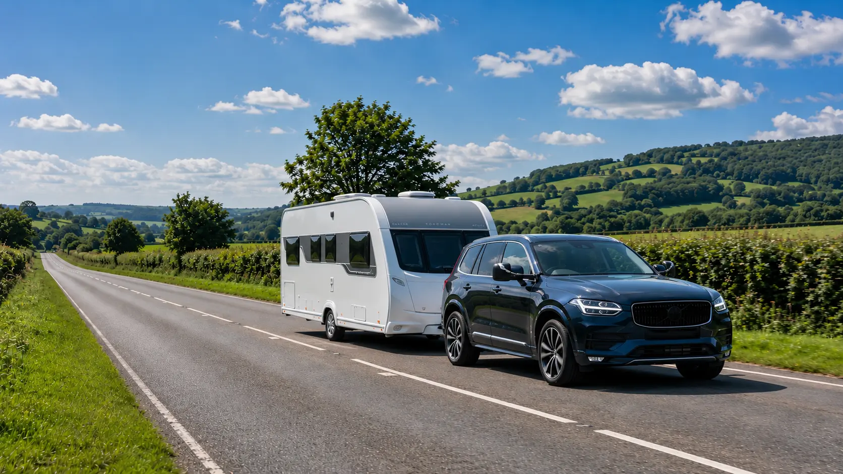 Modern SUV towing a UK touring caravan with correctly fitted towing mirrors