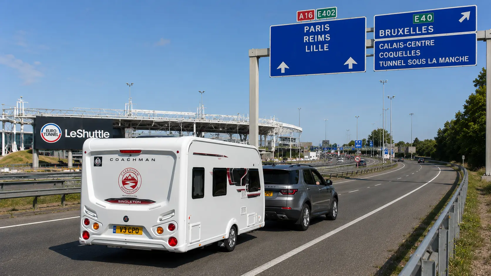 Silver Land Rover Discovery towing a Coachman Sussex Singleton caravan away from LeShuttle towards the French motorway network