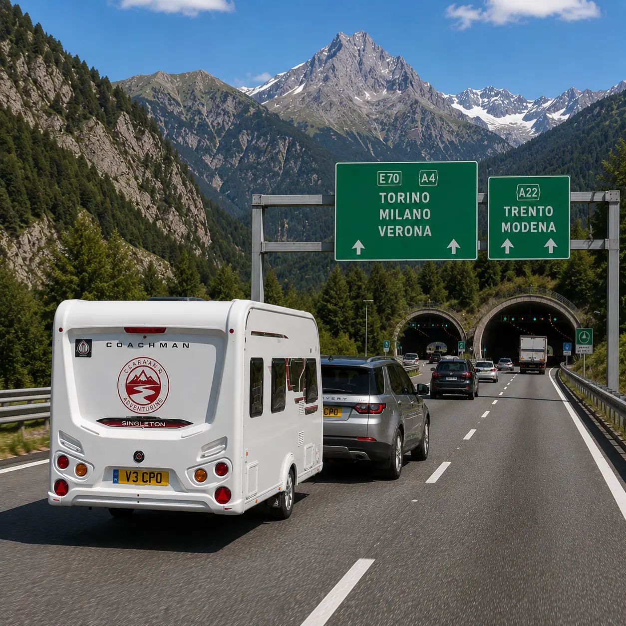 Silver Land Rover Discovery towing a Coachman Sussex Singleton caravan through the Alps towards Italy