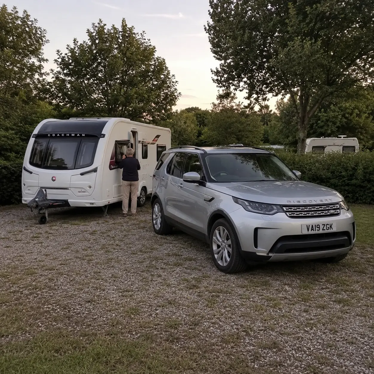 Silver Land Rover Discovery and Coachman Sussex Singleton caravan parked on an overnight touring pitch in Europe